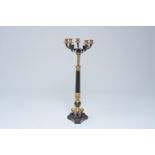 A French gilt and patinated bronze six-light candelabra with lion paws, 19th C.