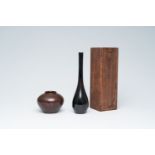 Yamamoto Kozan (1892): A Japanese black patinated bronze solifleur vase or sorori and a spherical va