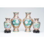 Two pairs of Chinese cloisonne vases with birds and butterflies among blossoming branches and floral