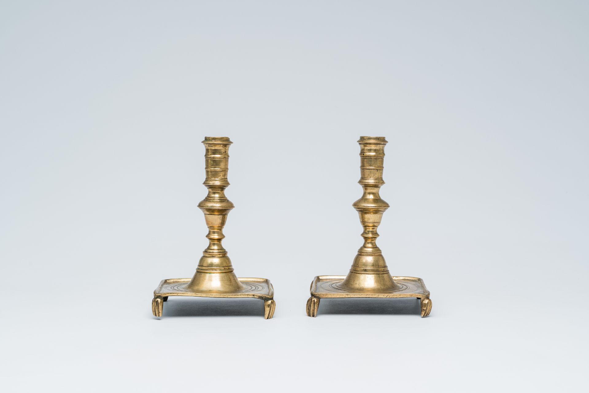 A pair of Spanish brass candlesticks, 17th/18th C. - Image 3 of 7