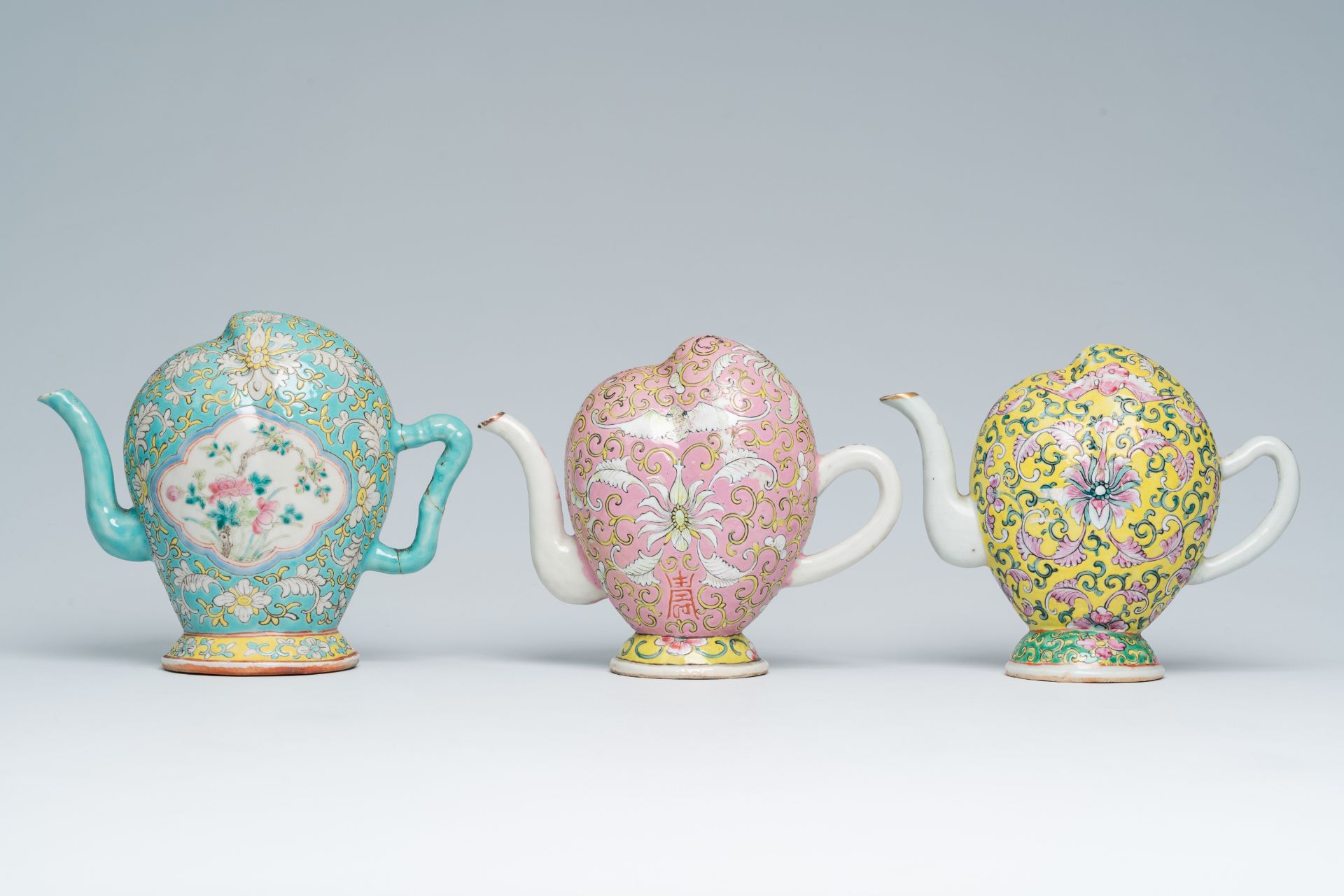 Three Chinese famille rose peach-shaped cadogan teapots with floral design, 19th C. - Image 4 of 7