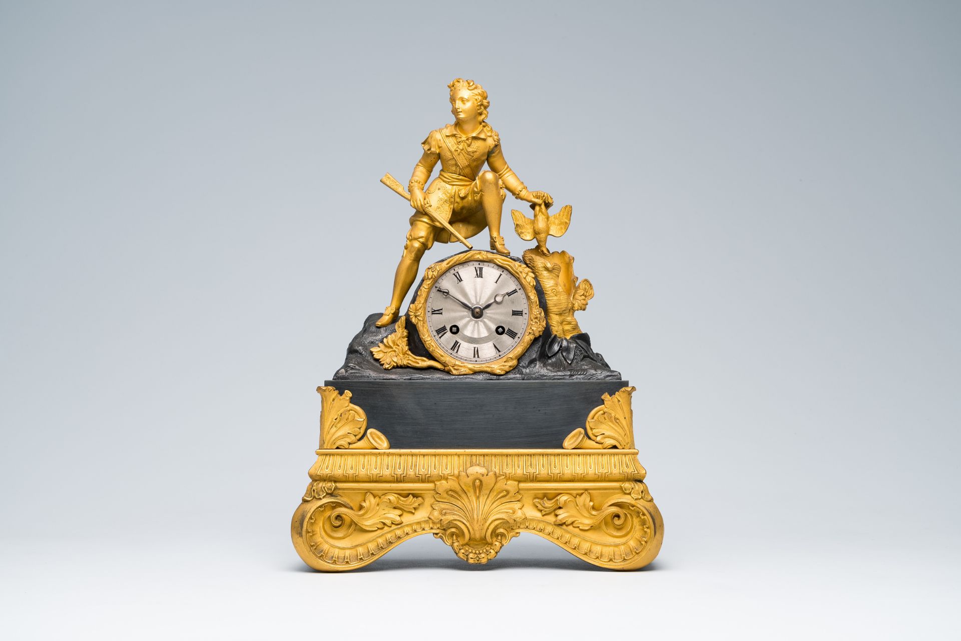 A French gilt and patinated bronze mantel clock topped with a hunter and his prey, 19th C. - Image 2 of 7