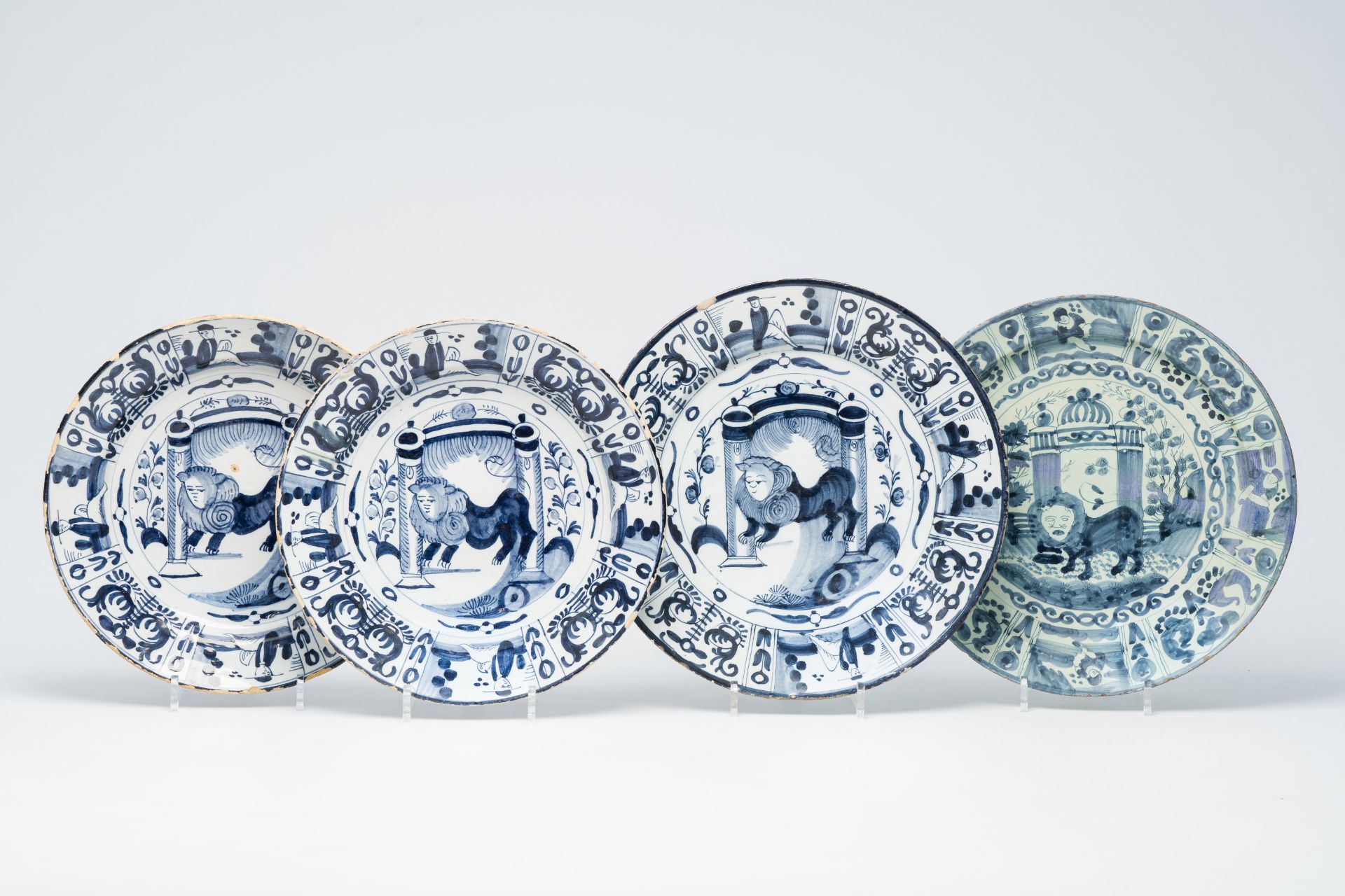 Four Dutch Delft blue and white dishes with the 'Lion of Judah', 18th C.