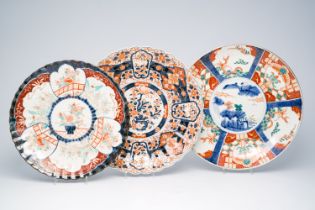 Three Japanese Imari dishes with floral design, landscapes and sea monsters, Meiji, 19th/20th C.