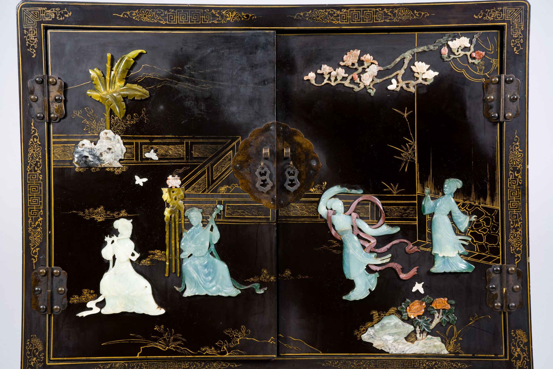 A Chinese lacquered wood cabinet inlaid with semi-precious stones showing ladies on a terrace, flowe - Image 2 of 13