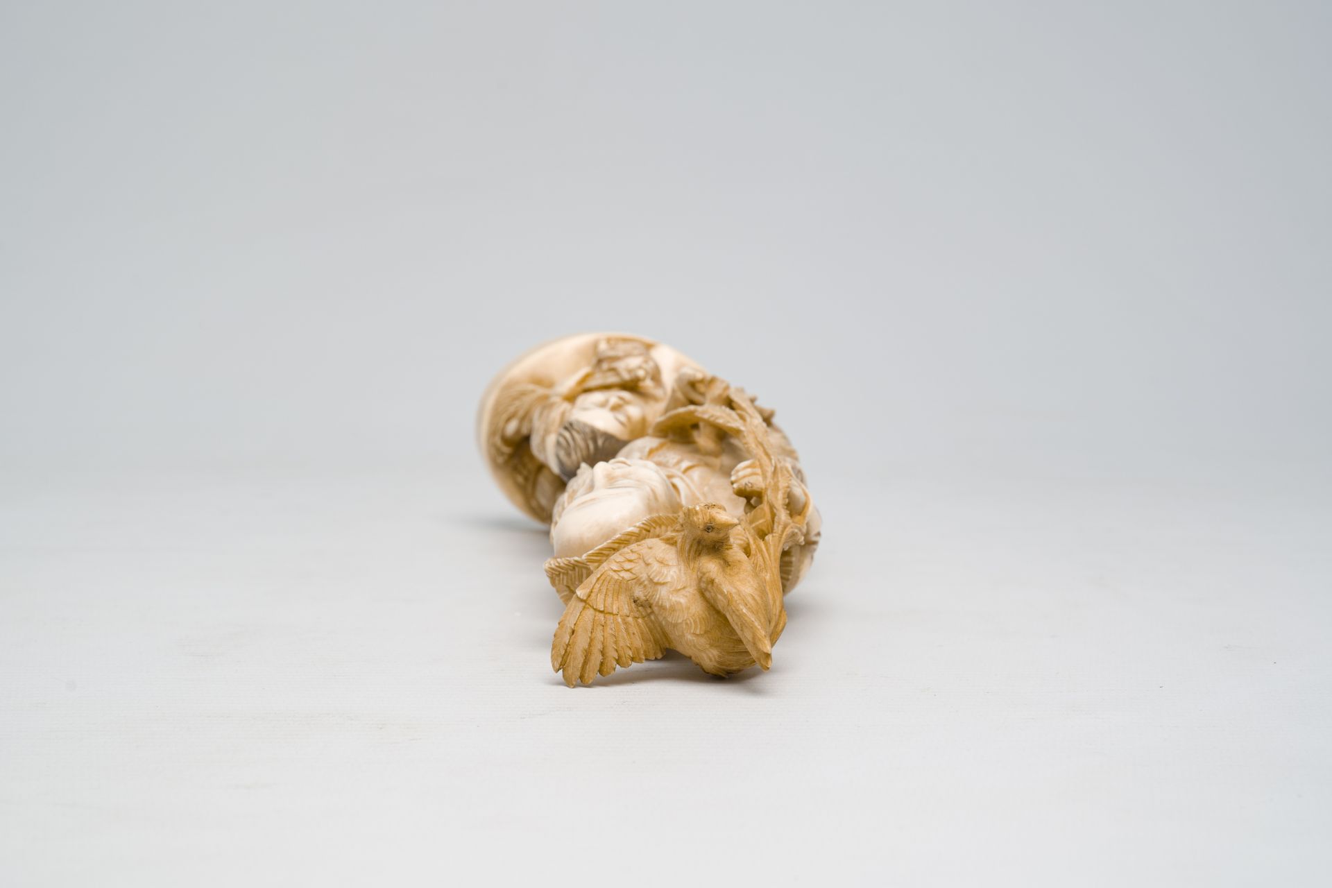 A Japanese ivory okimono of a laughing man with a child and a rooster, signed, Meiji, ca. 1900 - Image 6 of 7