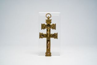 An engraved copper crucifix with relics of various saints, 19th/20th C.
