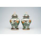 A pair of Chinese Nanking crackle glazed famille verte vases and covers with pheasants among blossom