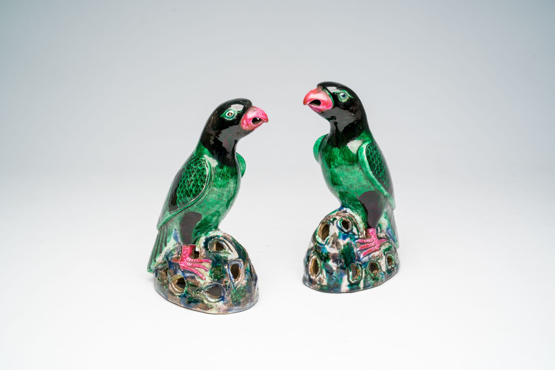 A pair of Chinese polychrome models of parrots, 19th/20th C.