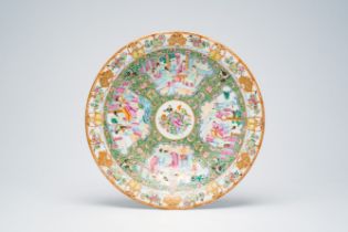 A Chinese Canton famille rose dish with palace scenes, antiquities and 'twin fish', 19th C.