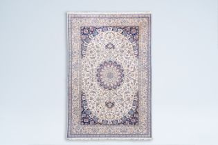 A Persian Nain rug with floral design, wool and silk on cotton, 6la, Iran, 20th C.