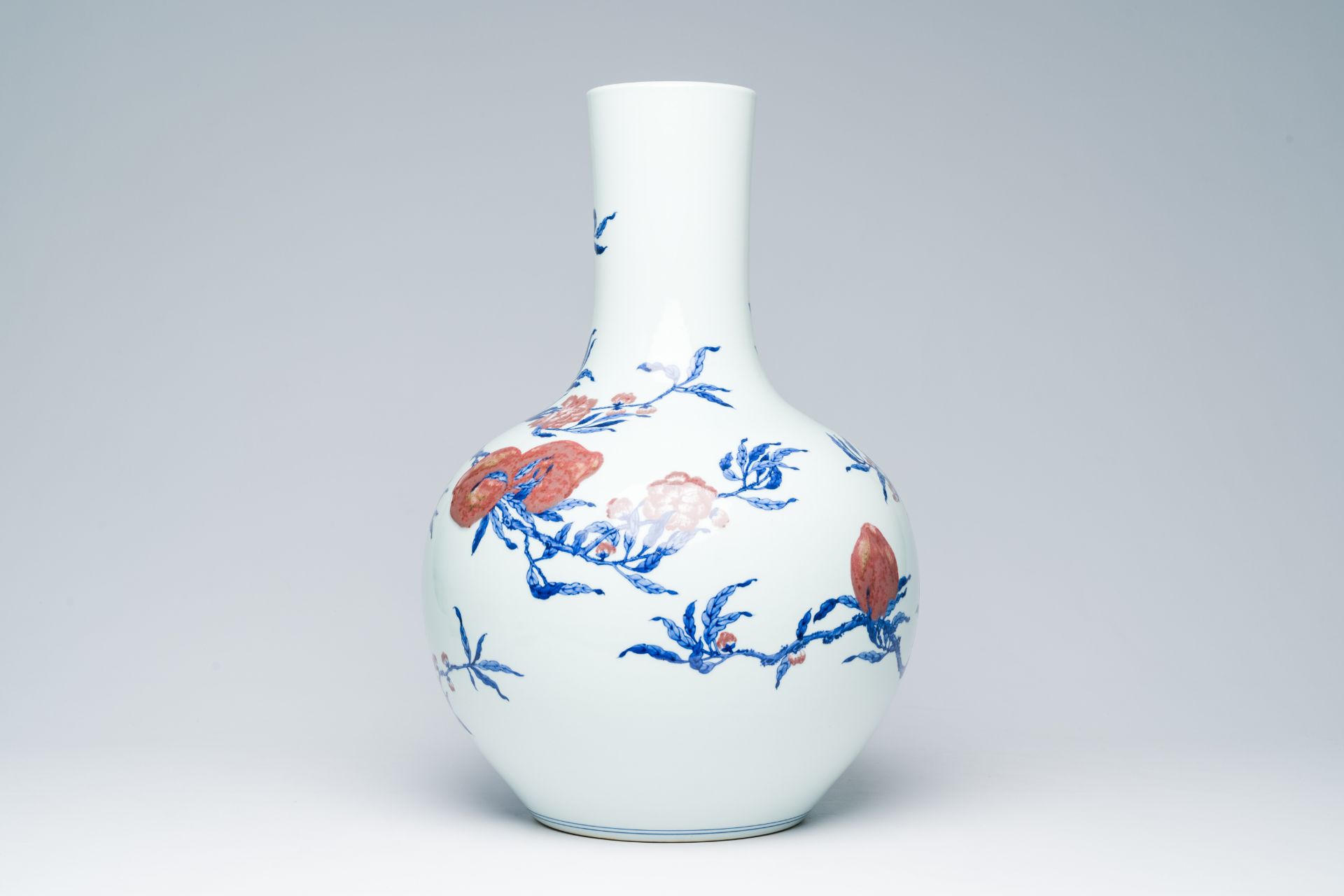 A Chinese blue, white and copper-red 'nine peaches' tianqu ping vase, Qianlong mark, 20th C. - Image 3 of 6