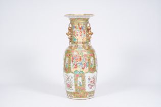 A large Chinese Canton famille rose vase with palace scenes and birds and butterflies among blossomi