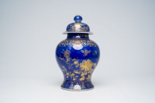 A Chinese powder blue and gilt vase and cover with floral design, 19th C.