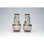 A pair of Chinese Nanking crackle glazed famille rose 'warrior' vases with dragons chasing the pearl