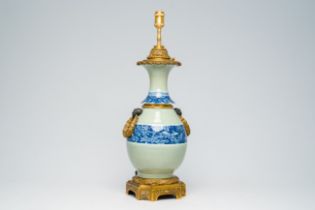 A Chinese blue and white celadon ground vase with floral design mounted as a lamp, 19th C.