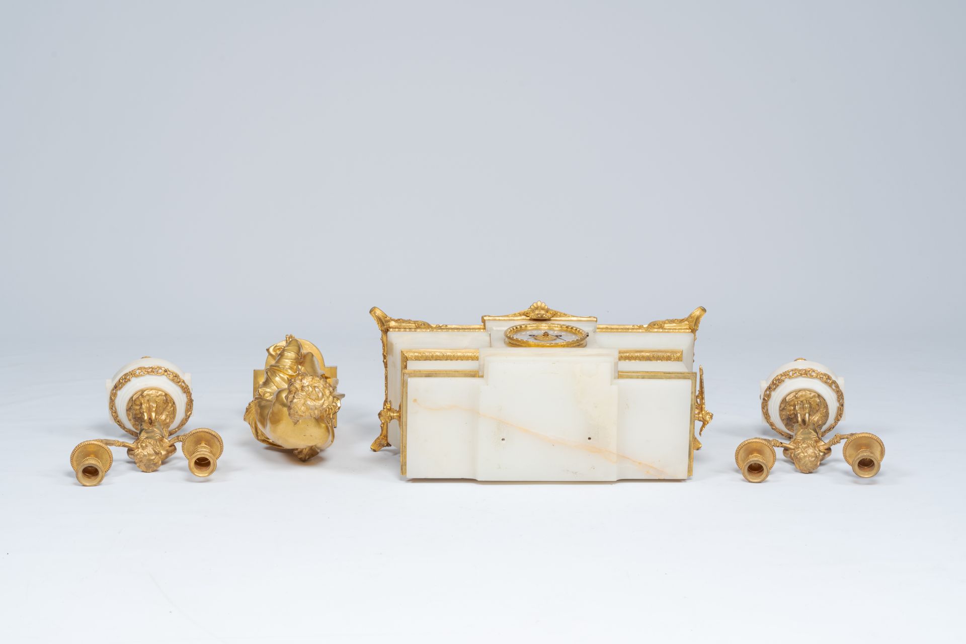 A French gilt bronze mounted marble and alabaster three-piece clock garniture with Susanna and satyr - Image 4 of 7