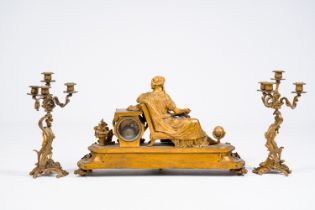 A French gilt bronze three-piece clock garniture with putti and a reading lady, 19th C.