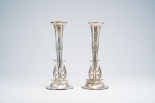 A pair of German silver solifleur vases with relief design transformable into candlesticks, first ha