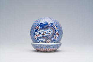 A Chinese blue, white and copper-red 'dragons' seal paste box, 19th C.