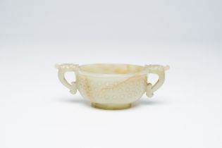 A Chinese celadon jade two-handled bowl, 18th C.