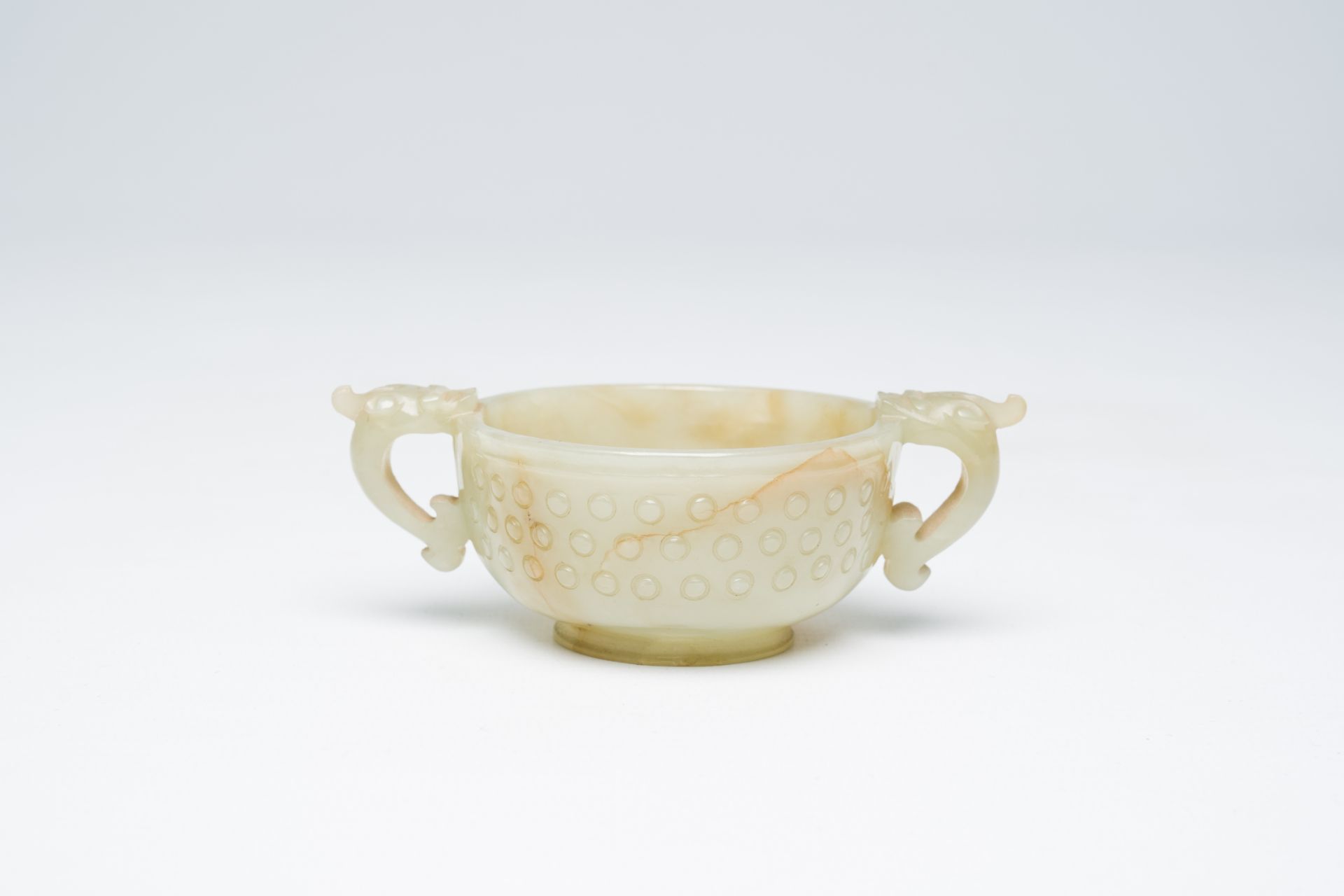 A Chinese celadon jade two-handled bowl, 18th C.