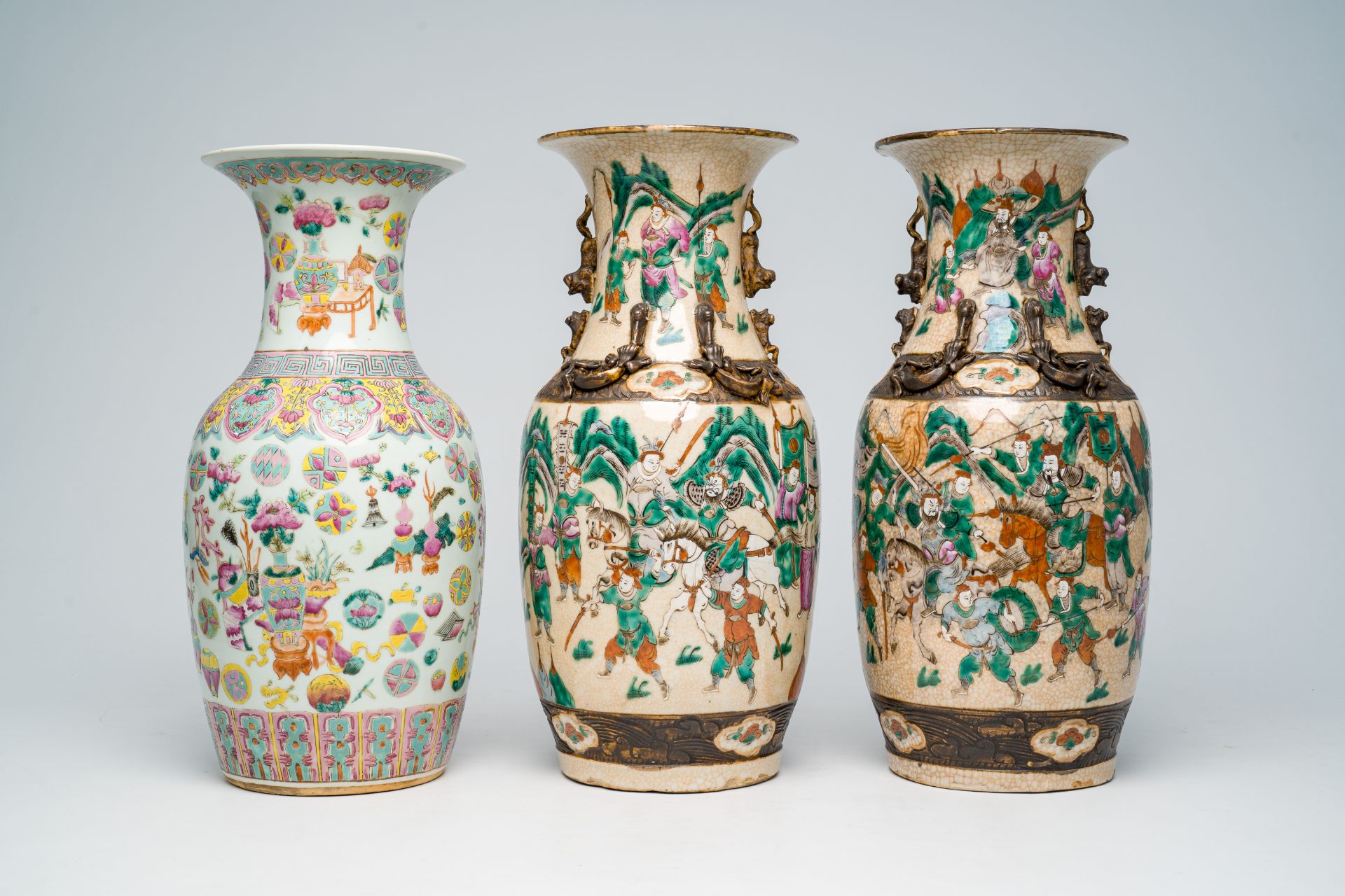 Two Chinese Nanking crackle glazed famille rose 'warrior' vases and an 'antiquities' vase, 19th C. - Image 2 of 7