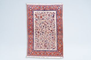 A Persian Isfahan rug with floral design, wool on cotton, Iran, mid 20th C.