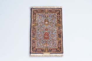 A Persian Goum rug with floral design, wool on cotton, Iran, 20th C.