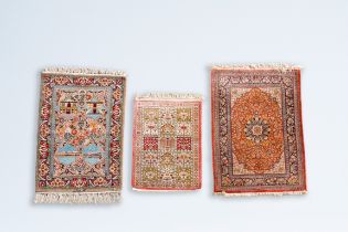 Three Oriental rugs with floral design and landscapes, wool and silk on cotton, 20th C.