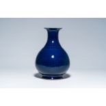 A Chinese monochrome blue vase with underglaze design, 19th/20th C.