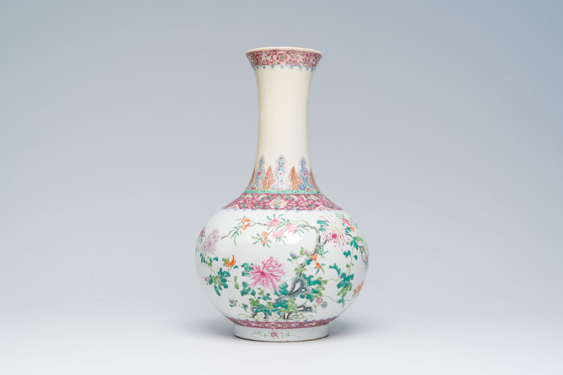 A Chinese famille rose bottle shaped vase with floral design, Hongxian mark, 20th C.