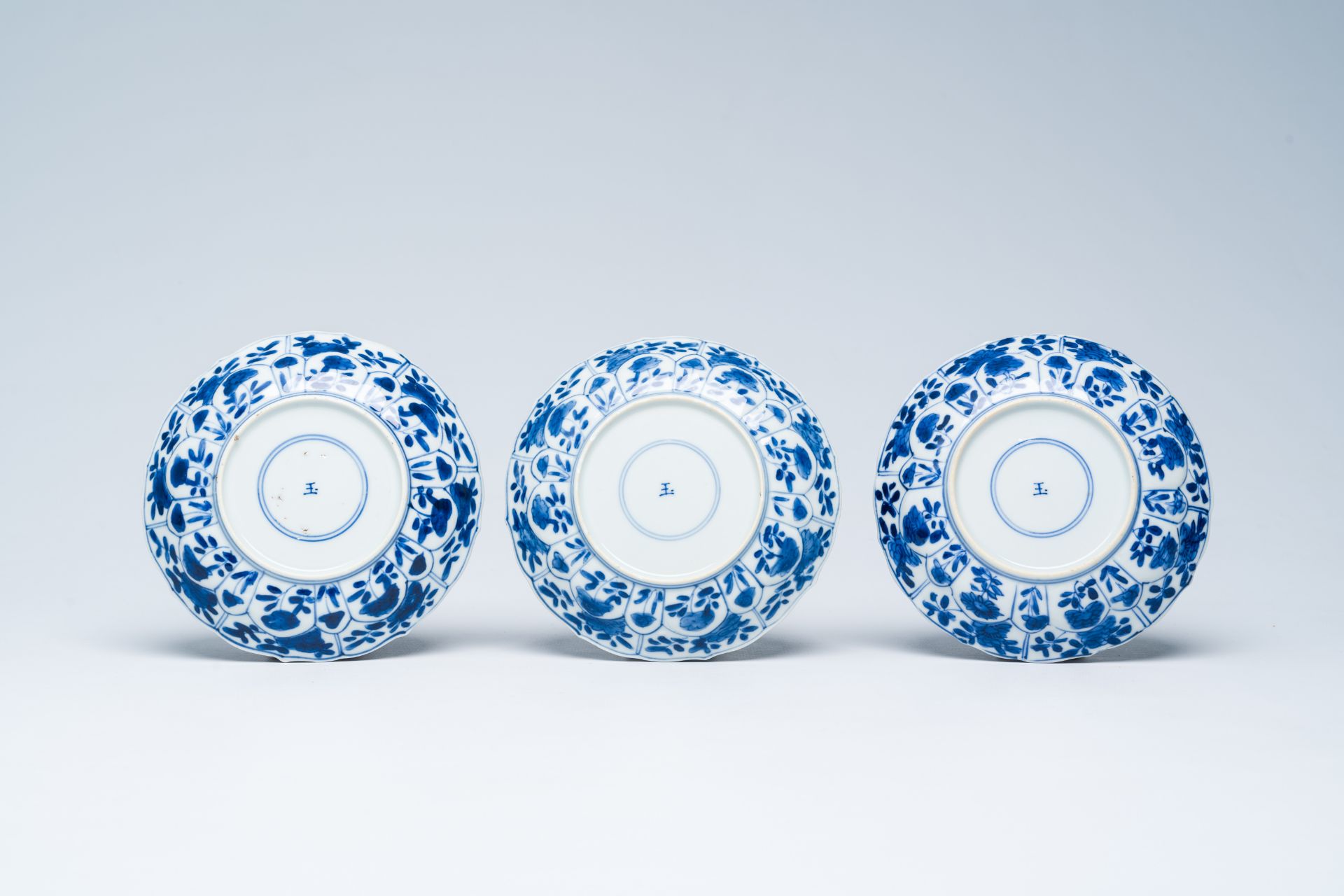 Six Chinese blue and white saucers with floral design, Kangxi - Image 3 of 5