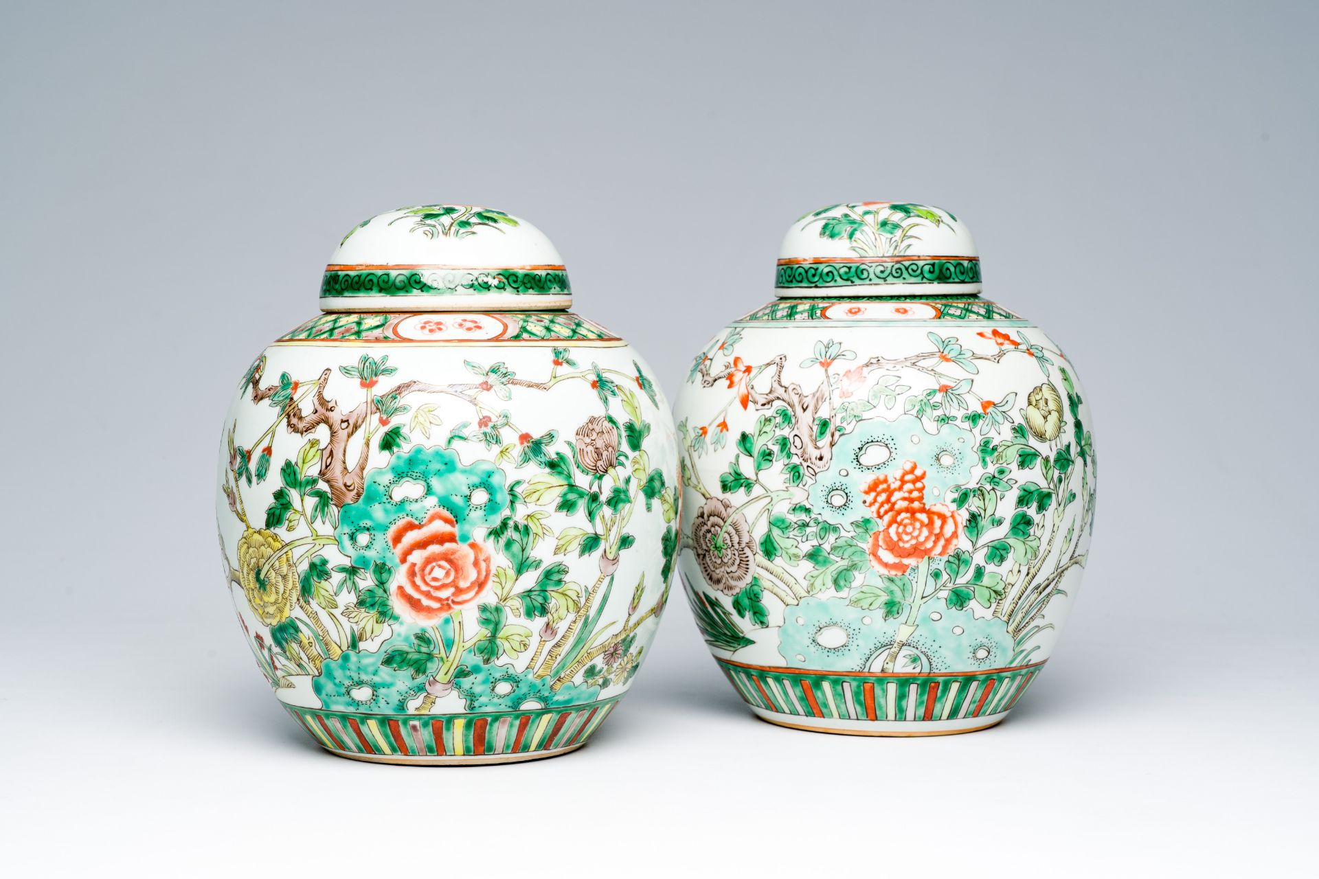 Two Chinese famille verte jars and covers with floral design, 19th C.