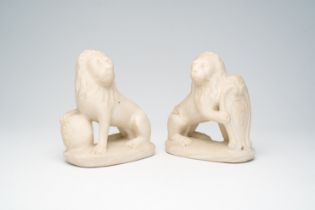 A pair of Italian marble lions holding shields with coats of arms, 19th C.