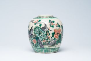 A Chinese crackle glazed famille verte jar with birds among blossoming branches, 19th C.