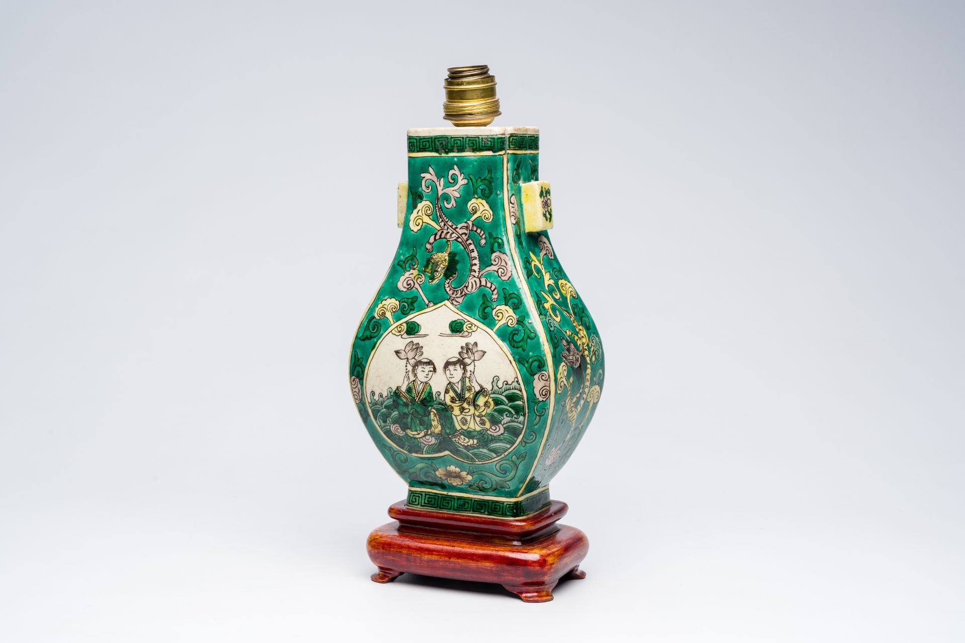 A Chinese verte biscuit 'fanghu' vase with two boys mounted as a lamp, 19th C.