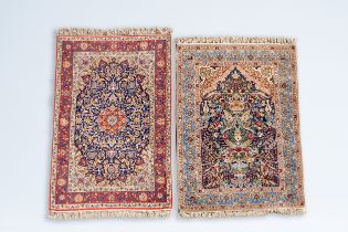 Two Oriental rugs with floral design, a.o. a Persian Isfahan rug, wool on cotton, 20th C.