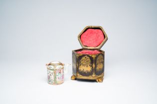 A Chinese hexagonal export Canton black- and gold-lacquer tea box with a matching famille rose teapo