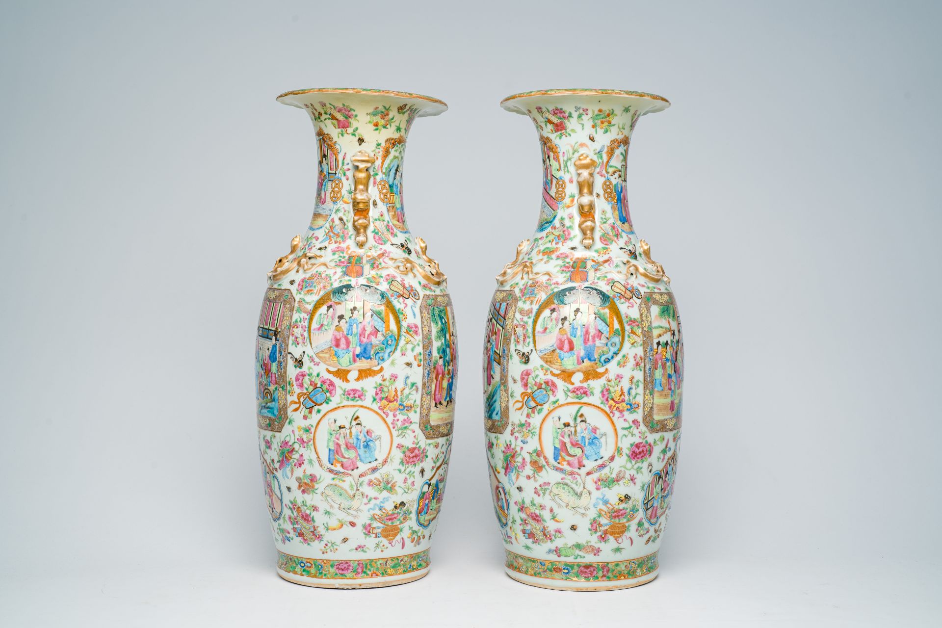 A pair of Chinese Canton famille rose vases with palace scenes and floral design, 19th C. - Image 4 of 7