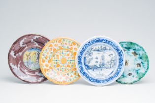 Four various polychrome Italian, French and Brussels plates, 17th/19th C.