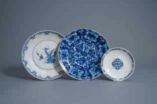 Two Dutch Delft blue and white dishes and a plate with floral design, early 18th C.