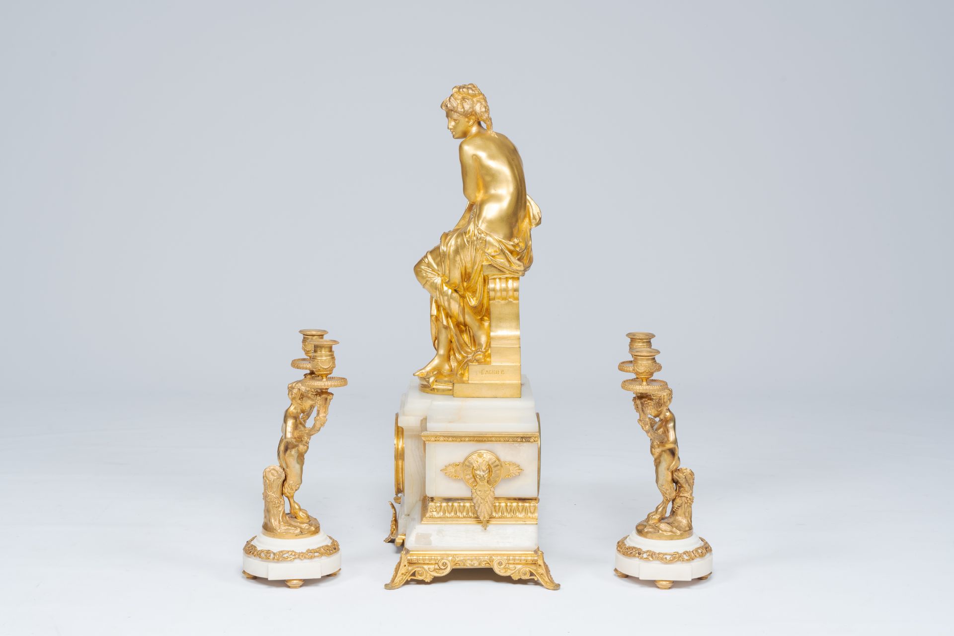 A French gilt bronze mounted marble and alabaster three-piece clock garniture with Susanna and satyr - Image 3 of 7