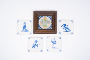 Five Dutch Delft blue, white and polychrome tiles with birds and three tulips, 17th C.