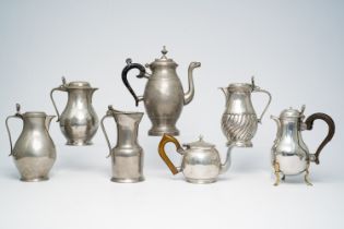 A varied collection of pewter jugs and a pair of candlesticks, a.o. Ath, Brussels and Ghent, 18th/19