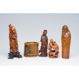 Four various Chinese wood figures and an openworked bamboo brush pot, 19th/20th C.