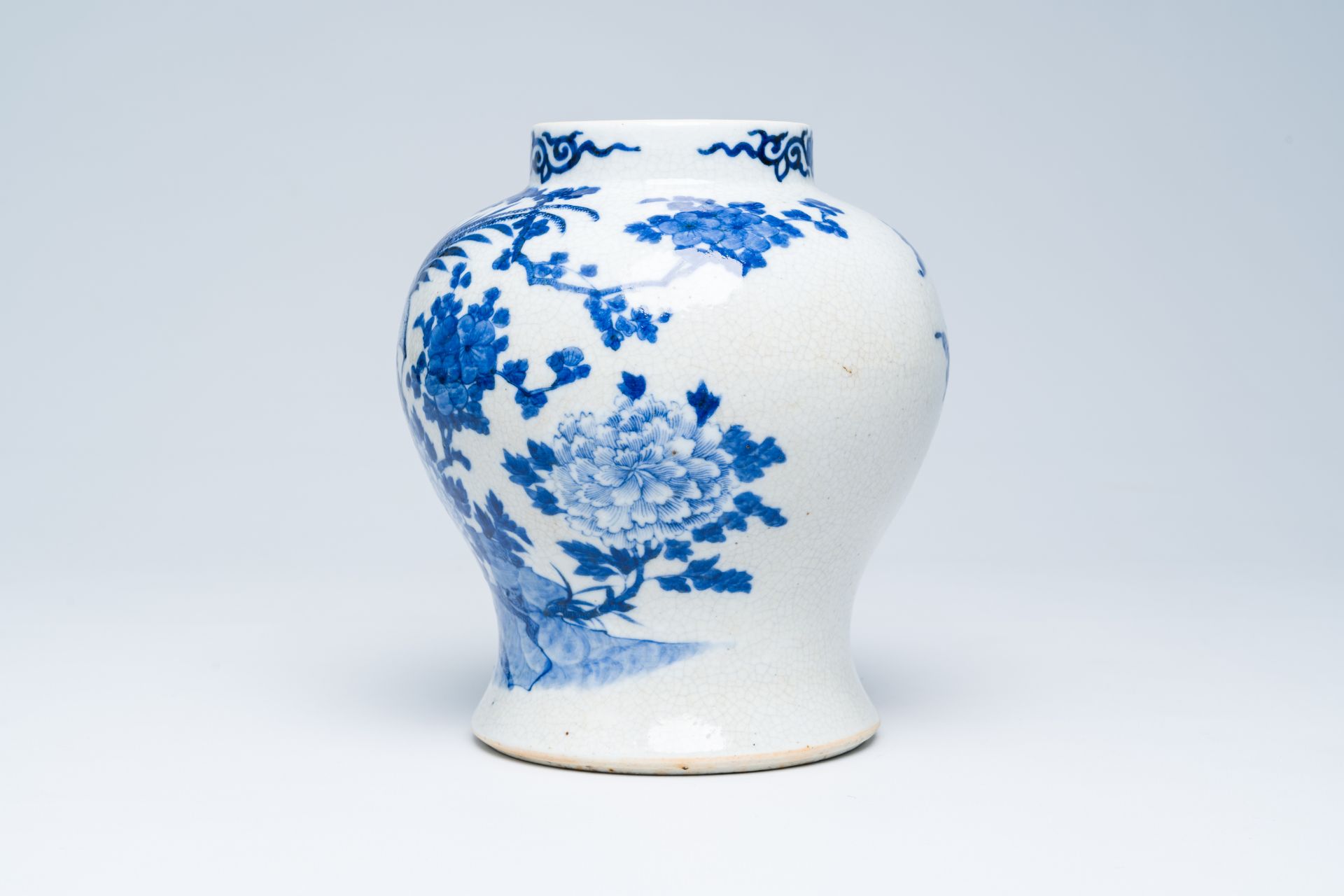 A Chinese crackle glazed blue and white vase with a bird among blossoming branches, 19th C. - Image 2 of 6