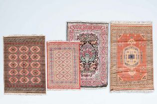 Four various Oriental rugs with floral and geometric design, wool and silk on cotton, 20th C.