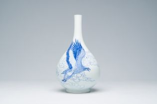 A Chinese blue and white pear-shaped vase with an eagle, Jingdezhen mark, 20th C.