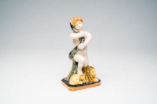 A Brussels polychrome faience group of a putto with a snake on a lion, late 18th C.